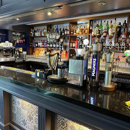 The Tudor Hotel Airdrie Bagian luar foto